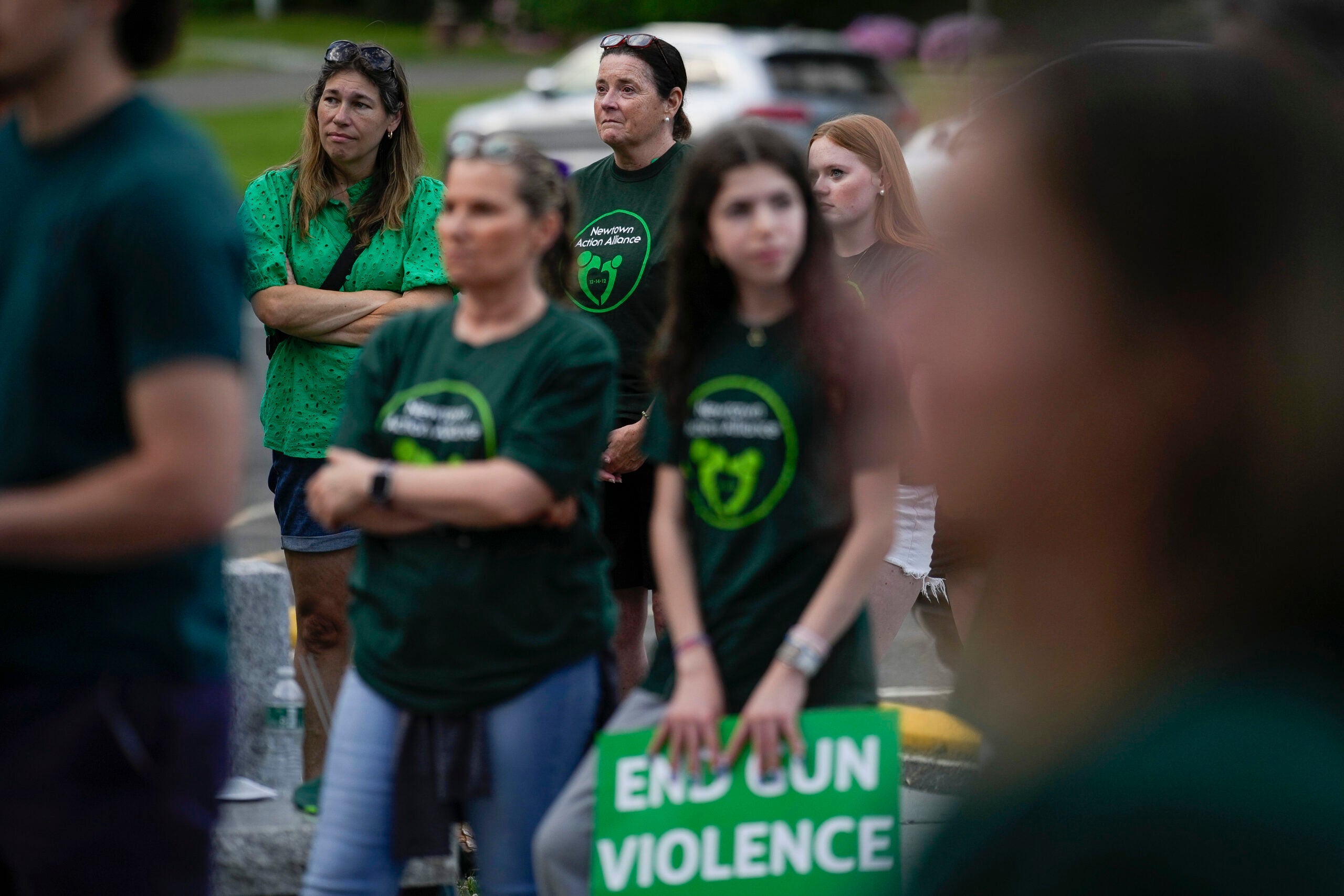 Local residents join survivors of the 2012 Sandy Hook Elementary School shooting for a rally.