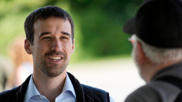 State Rep. Austin Theriault, R-Fort Kent, speaks with a voter.