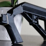 A bump stock is displayed in Harrisonburg, Va.