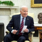 President Joe Biden listens as he meets with NATO Secretary General Jens Stoltenberg in the Oval Office at the White House.