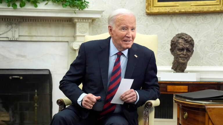 President Joe Biden listens as he meets with NATO Secretary General Jens Stoltenberg in the Oval Office at the White House.
