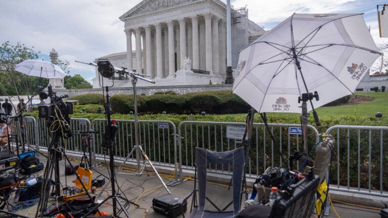 Broadcast media equipment is set up outside the Supreme Court.
