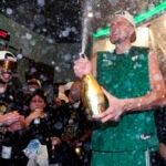 Boston Celtics center Kristaps Porzingis sprays champagne while celebrating after defeating the Dallas Mavericks