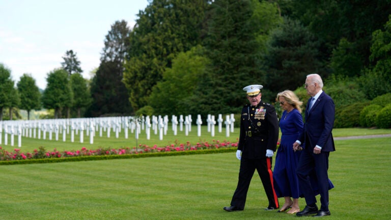 President Joe Biden and First Lady Jill Biden walk with Major General Robert B. Sofge Jr. as they attend a wreath laying ceremony at the Aisne-Marne American World War One Cemetery in Belleau, France, Sunday, June 9, 2024.