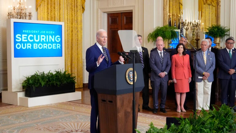 President Joe Biden, left, speaks about an executive order in the East Room at the White House in Washington, Tuesday, June 4, 2024. Biden unveiled plans to enact immediate significant restrictions on migrants seeking asylum at the U.S.-Mexico border as the White House tries to neutralize immigration as a political liability ahead of the November elections.