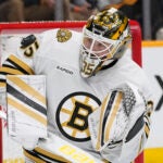 Boston Bruins goaltender Linus Ullmark (35) blocks a shot on goal during the second period of an NHL hockey game against the Nashville Predators, Tuesday, April 2, 2024, in Nashville, Tenn.