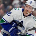 Vancouver Canucks center Elias Lindholm (23) in the third period of an NHL hockey game Tuesday, Feb. 20, 2024, in Denver.