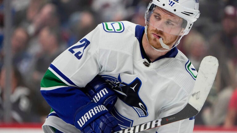 Vancouver Canucks center Elias Lindholm (23) in the third period of an NHL hockey game Tuesday, Feb. 20, 2024, in Denver.