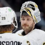 SEATTLE, WASHINGTON - FEBRUARY 26: Linus Ullmark #35 and Parker Wotherspoon #29 of the Boston Bruins talk during the first period against the Seattle Kraken at Climate Pledge Arena on February 26, 2024 in Seattle, Washington.