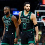 Boston Celtics forward Jayson Tatum (0) walks off the court with Boston Celtics guard Jaylen Brown (7) during the third quarter in Game 2 of the NBA Finals. The Boston Celtics hosted the Dallas Mavericks at TD Garden on Sunday, June 9, 2024.