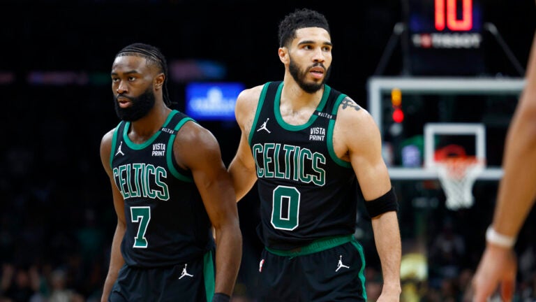 Boston Celtics forward Jayson Tatum (0) walks off the court with Boston Celtics guard Jaylen Brown (7) during the third quarter in Game 2 of the NBA Finals. The Boston Celtics hosted the Dallas Mavericks at TD Garden on Sunday, June 9, 2024.