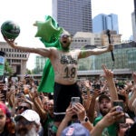 Riley Walters of Hudson, NH cheered during a duck boat parade to celebrate the 18th Boston Celtics NBA championship on Friday, June 21, 2024. The Celtics defeated the Dallas Mavericks in Game 5 of the NBA Finals.