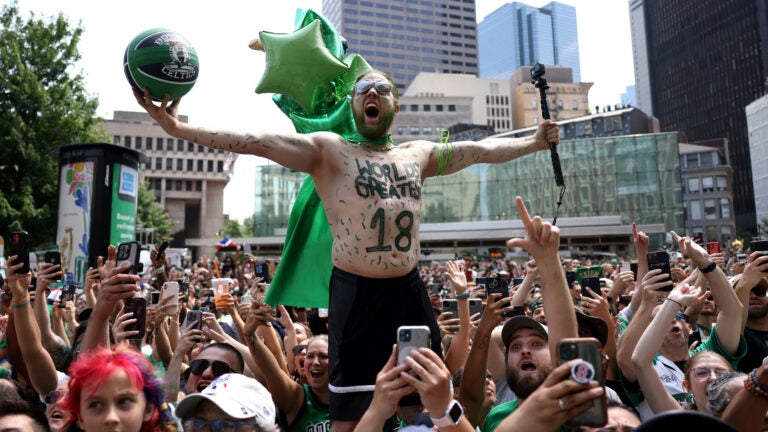 Riley Walters of Hudson, NH cheered during a duck boat parade to celebrate the 18th Boston Celtics NBA championship on Friday, June 21, 2024. The Celtics defeated the Dallas Mavericks in Game 5 of the NBA Finals.