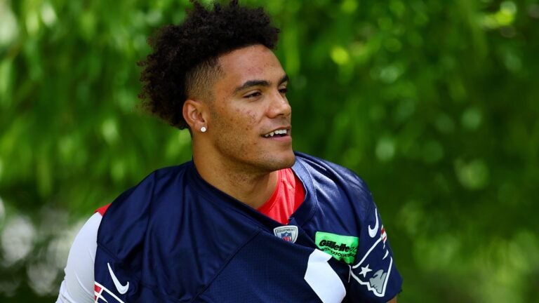 FOXBOROUGH, MASSACHUSETTS - MAY 29: Christian Gonzalez #0 of the New England Patriots walks to the field during the New England Patriots OTA Offseason Workout on May 29, 2024 in Foxborough, Massachusetts.