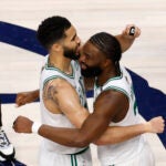 Boston Celtics forward Jayson Tatum, left, and guard Jaylen Brown hug after winning Game 3 of the NBA Finals. The Dallas Mavericks hosted the Boston Celtics at American Airlines Center on Wednesday, June 12, 2024.