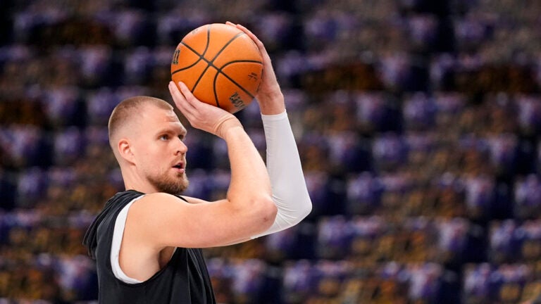 Boston Celtics center Kristaps Porzingis works out prior to Game 4 of the NBA basketball finals against the Dallas Mavericks, Friday, June 14, 2024, in Dallas.