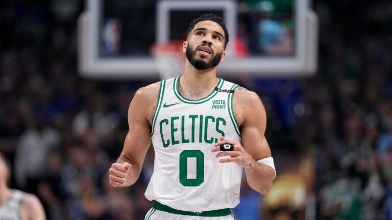 Boston Celtics forward Jayson Tatum looks on during the first half in Game 3 of the NBA basketball finals against the Dallas Mavericks, Wednesday, June 12, 2024, in Dallas.