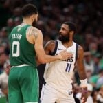 BOSTON, MASSACHUSETTS - JUNE 17: s #0 of the Boston Celtics hugs Kyrie Irving #11 of the Dallas Mavericks as Irving exits the game during the fourth quarter of Game Five of the 2024 NBA Finals at TD Garden on June 17, 2024 in Boston, Massachusetts.