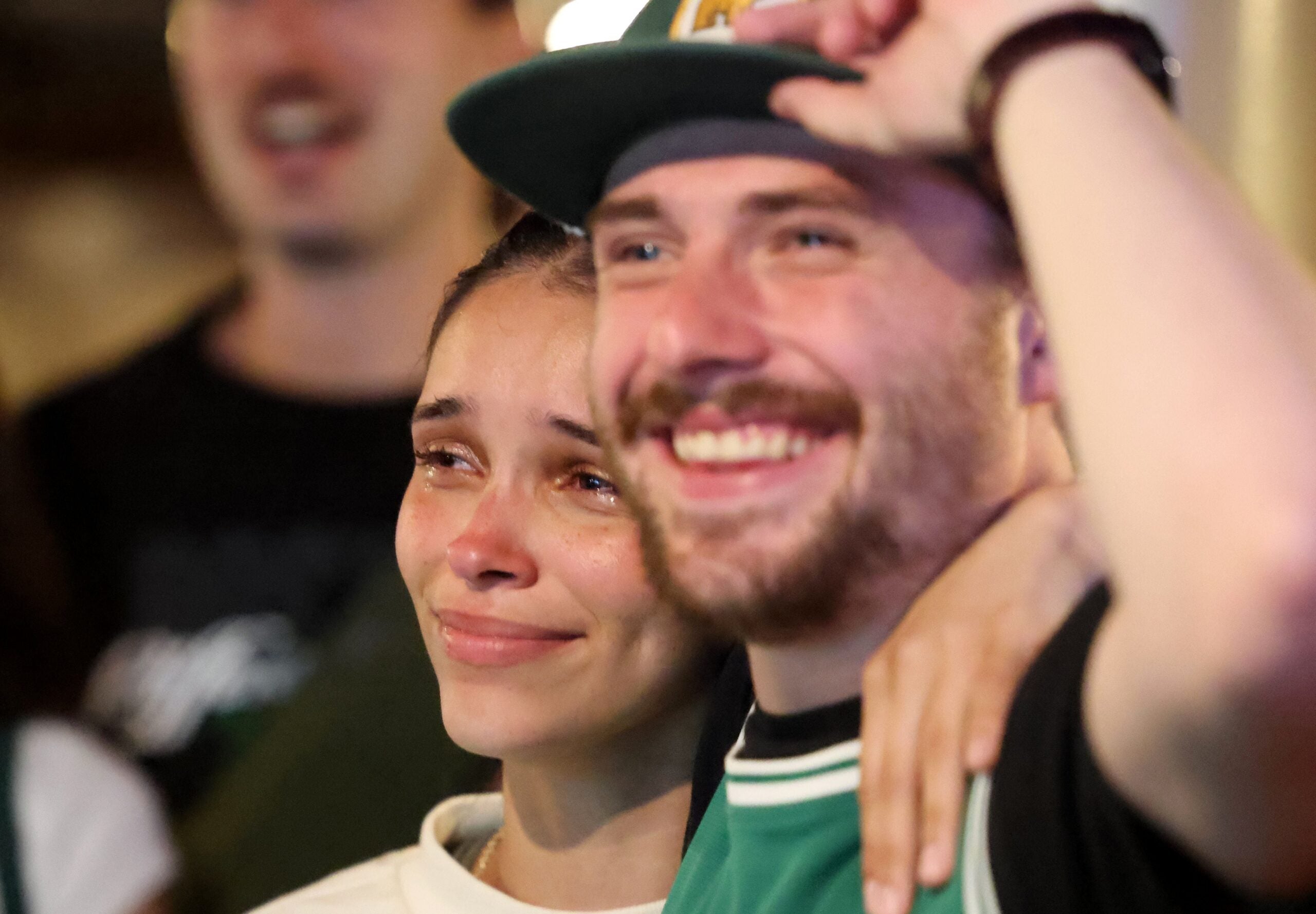 A Celtics fan wept Monday as she celebrated inside The Harp. 