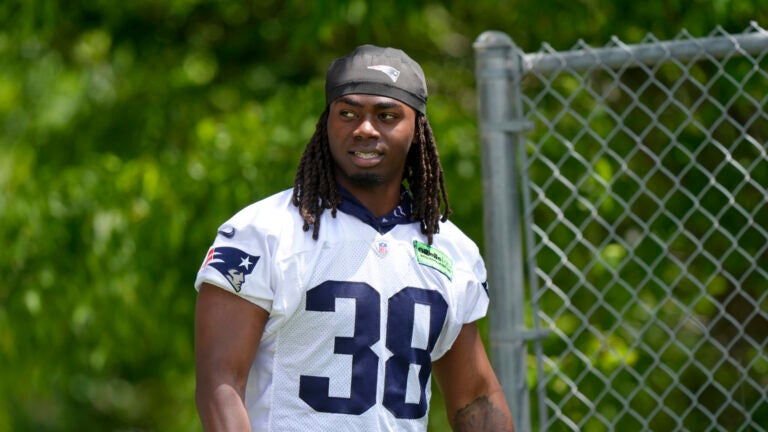 New England Patriots running back Rhamondre Stevenson (38) steps on the field for an NFL football practice, Wednesday, May 29, 2024, in Foxborough, Mass.