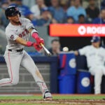 The Red Sox's Ceddanne Rafaela hits a double against the Toronto Blue Jays during the seventh inning.