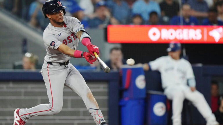 The Red Sox's Ceddanne Rafaela hits a double against the Toronto Blue Jays during the seventh inning.