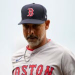 Boston Red Sox manager Alex Cora jogs to the dugout after a pitching change in the fourth inning of a baseball game against the Cincinnati Reds in Cincinnati, Sunday, June 23, 2024.