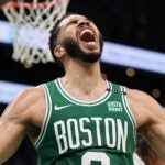 BOSTON, MASSACHUSETTS - JUNE 17: Jayson Tatum #0 of the Boston Celtics reacts after a play during the second quarter of Game Five of the 2024 NBA Finals against the Dallas Mavericks at TD Garden on June 17, 2024 in Boston, Massachusetts.