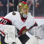 Ottawa Senators goaltender Joonas Korpisalo (70) warms up before an NHL hockey game against the Minnesota Wild Tuesday, April 2, 2024, in St. Paul, Minn.