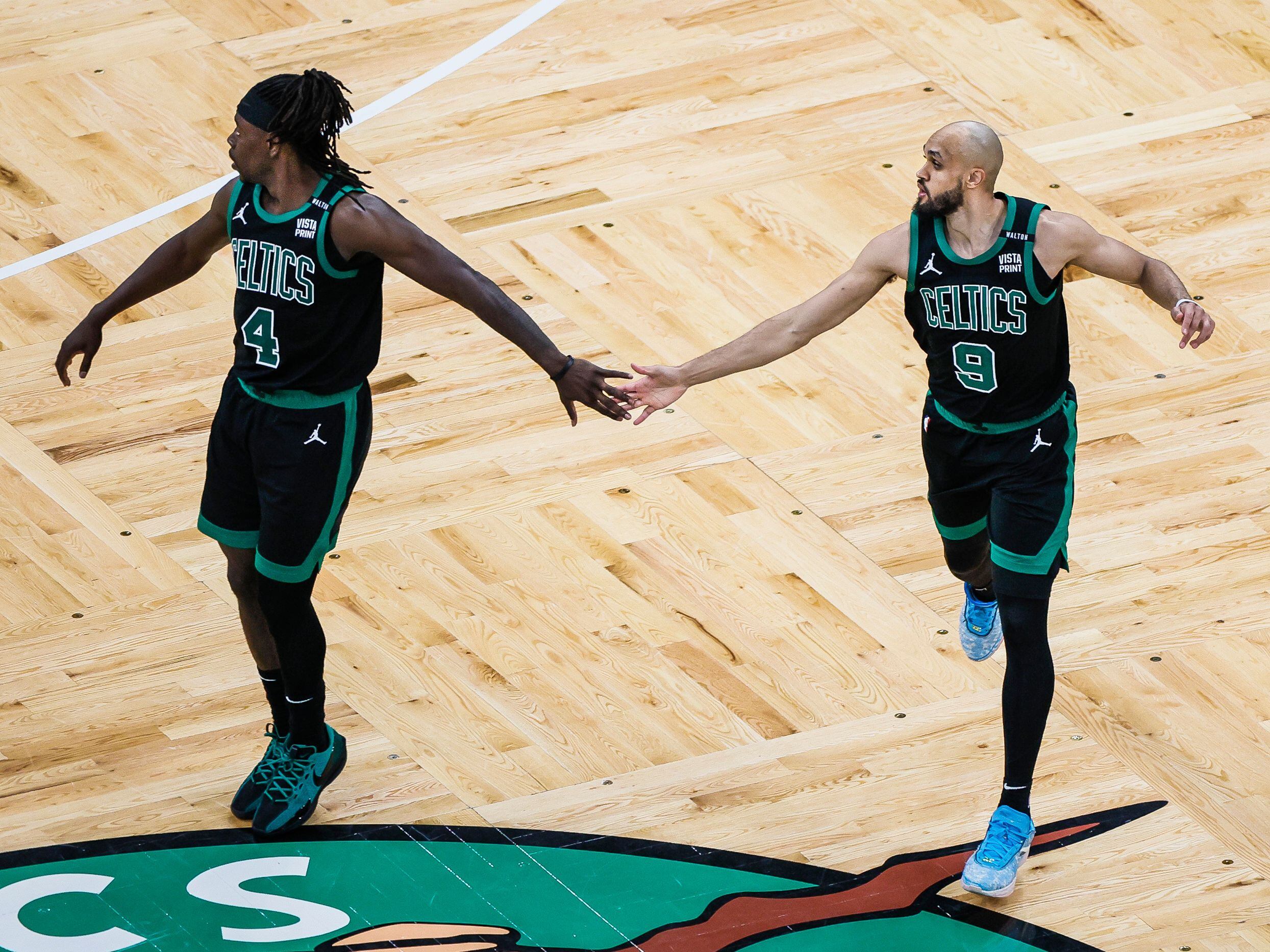 Jrue Holiday and Derrick White. 