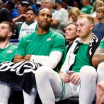 Boston Celtics center Al Horford and Boston Celtics forward Sam Hauser watch from the bench during the fourth quarter in Game 4 of the NBA Finals. The Dallas Mavericks hosted the Boston Celtics at American Airlines Center on Friday, June 14, 2024.