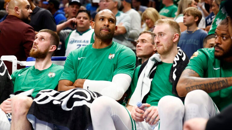 Boston Celtics center Al Horford and Boston Celtics forward Sam Hauser watch from the bench during the fourth quarter in Game 4 of the NBA Finals. The Dallas Mavericks hosted the Boston Celtics at American Airlines Center on Friday, June 14, 2024.