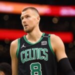 BOSTON, MASSACHUSETTS - JUNE 09: Kristaps Porzingis #8 of the Boston Celtics looks on during the first quarter against the Dallas Mavericks in Game Two of the 2024 NBA Finals at TD Garden on June 09, 2024 in Boston, Massachusetts.