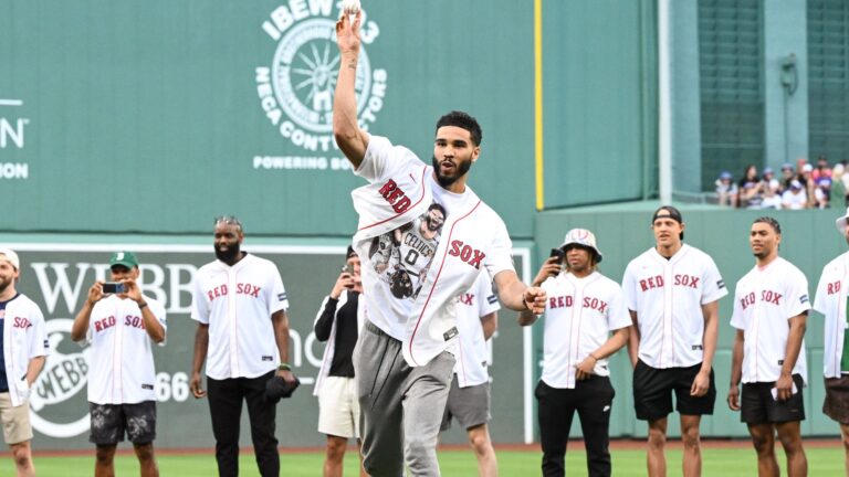 BOSTON, MASSACHUSETTS - JUNE 24: Jayson Tatum #0 of the Boston Celtics throws a ceremonial first pitch before a game between the Toronto Blue Jays and the Boston Red Sox at Fenway Park on June 24, 2024 in Boston, Massachusetts.