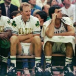Boston Celtics, from left, Robert Parish, Larry Bird, and Kevin McHale watch their team win over the Washington Bullets at the Boston Garden, in Boston, in this Nov. 30, 1991, file photo. Don't call them the Big Three yet. Paul Pierce, Kevin Garnett and Ray Allen aren't at the level of Larry Bird, Kevin McHale and Robert Parish when they led the Celtics to championships in the 1980s. But the new trio of stars would move Boston much closer to a shot at an NBA title.