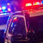 Police Vehicles with Flashing Lights.