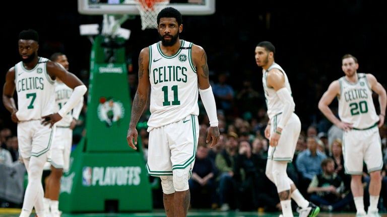 Boston Celtics' Kyrie Irving (11) and teammates, from left to right, Jaylen Brown, Marcus Morris, Jayson Tatum and Gordon Hayward wait for the ball to be put in play by the Milwaukee Bucks during the second half of Game 4 of a second-round NBA basketball playoff series in Boston, Monday, May 6, 2019.