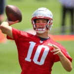 The Patriots held OTA’s at the Gillette Stadium practice field. Qb Drake Maye makes a pass during a drill.