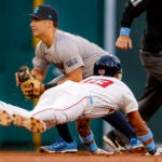 Red Sox Ceddanne Rafaela steals second base as New York Yankees shortstop Anthony Volpe waits for the throw during second inning.