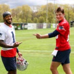 New England Patriots player Ja'Lynn Polk (cq) left and QB Drake Maye (cq) right share a laugh at the Patriots 2024 Rookie Mini-Camp.