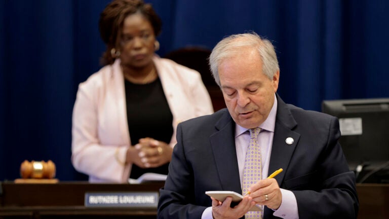 City Clerk Alex Geourntas tallies the Boston City Council’s vote on Mayor Michelle Wu’s property-tax policy earlier this month. Council president Ruthzee Louijeune is at left.