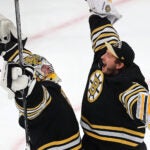 Boston Bruins goaltender Jeremy Swayman (1) (left) and Boston Bruins goaltender Linus Ullmark (35) congratulate one another at the end of the game.