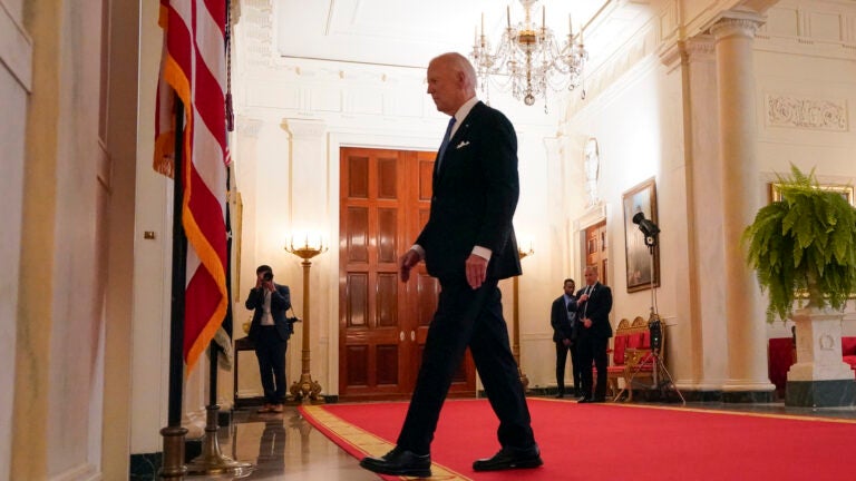 President Joe Biden walks from the podium after speaking in the Cross Hall of the White House in Washington.