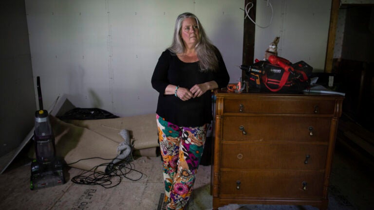 Lisa Edson-Neveu, 52 poses for a portrait at her house in Montpelier, Vt