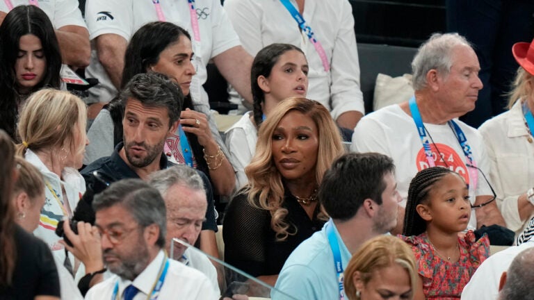 Serena Williams is seen in the stands.