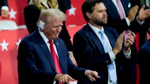 Trump enters Republican convention with a bandage covering ear