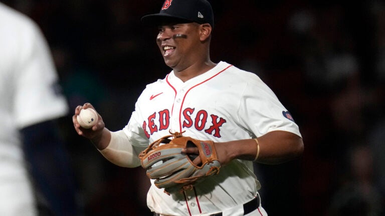 Red Sox third baseman Rafael Devers smiles after catching the final out, a flyout by Oakland Athletics' Lawrence Butler, at Fenway Park, Tuesday, July 9, 2024.