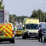 Emergency services work at the scene in Southport, England, where a man has been detained and a knife has been seized after a number of people were injured in a reported stabbing, Monday July 29, 2024.