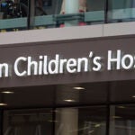 A sign hangs on the Boston Children's Hospital, Thursday, Aug. 18, 2022, in Boston.