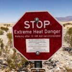 A sign reads "Stop Extreme Heat Danger" at Mesquite Flat Sand Dunes in Death Valley National Park near Furnace Creek during a heatwave impacting Southern California on July 7, 2024.